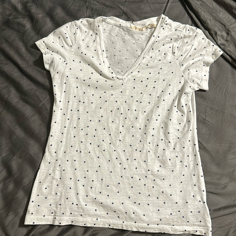 White shirt with blue stars.